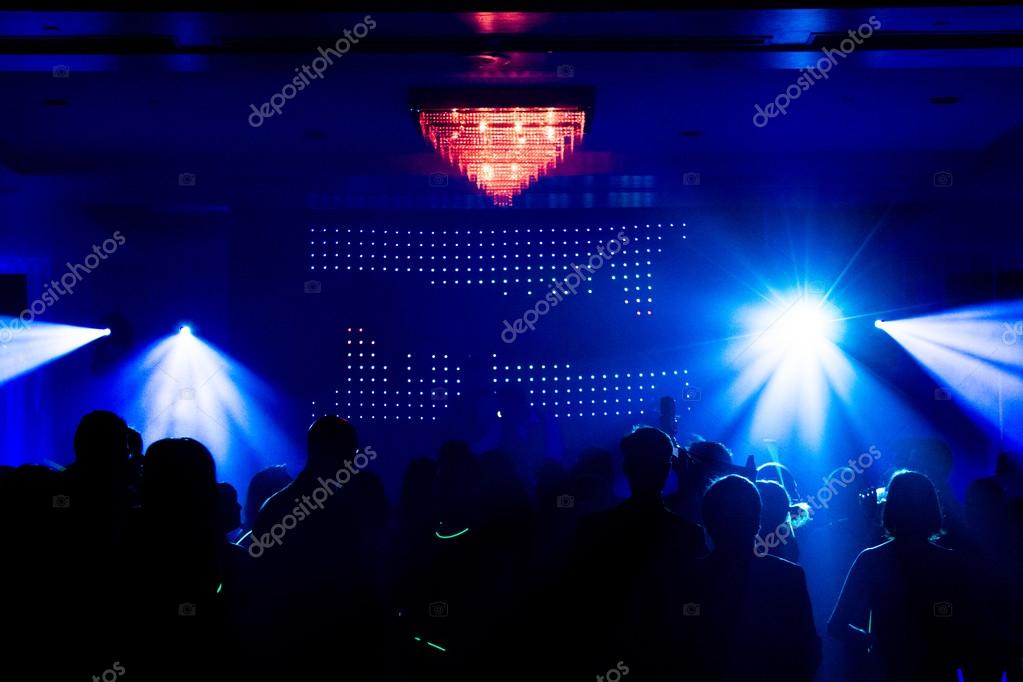 Live concert stage with LED wall and lighting in front of a crowd