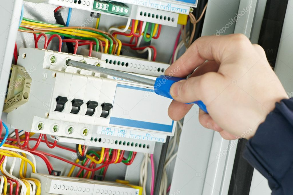 Technicians installing structured cabling and hardware in a commercial space