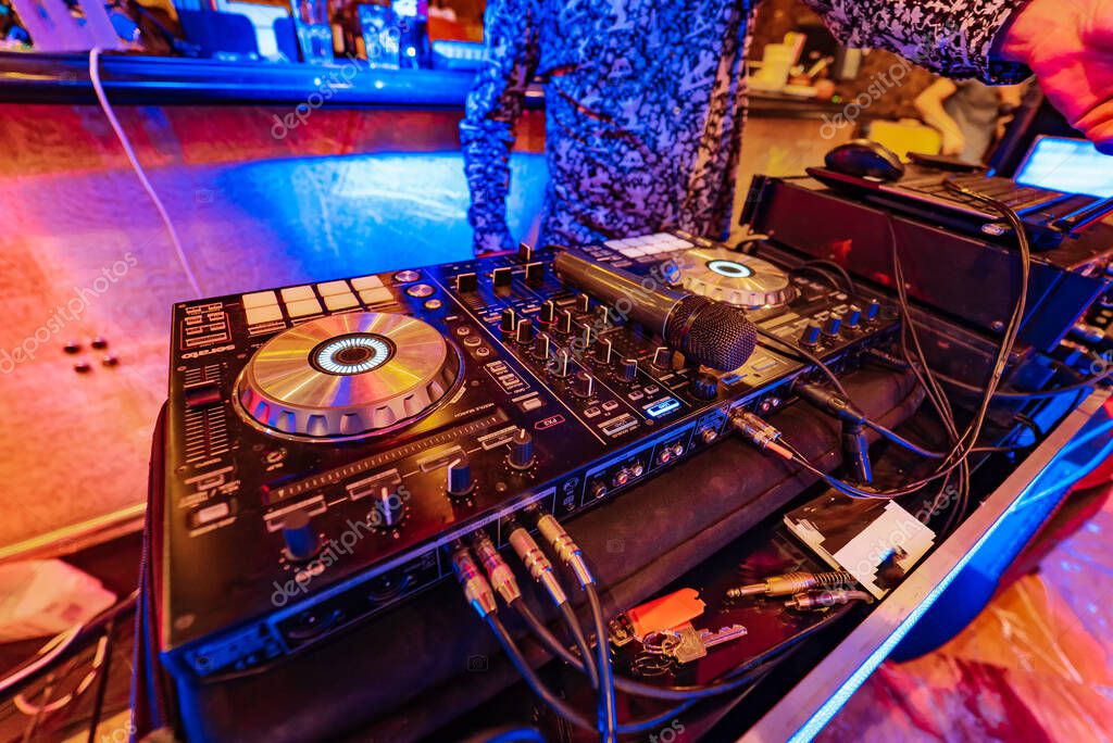 Audio mixing desk and speakers set up for an event