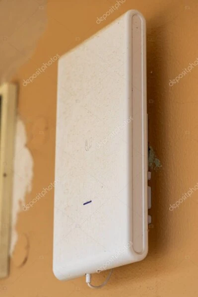 Enterprise WiFi access point installed in a modern office ceiling